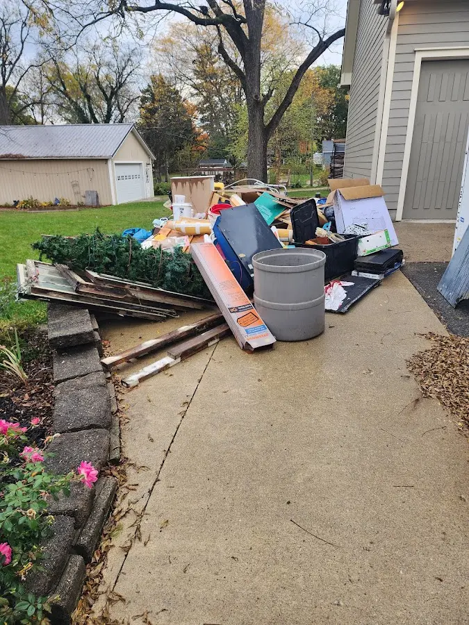 Dumpster being loaded with debris for Estate Cleanout Dumpster Rental in Red Chute